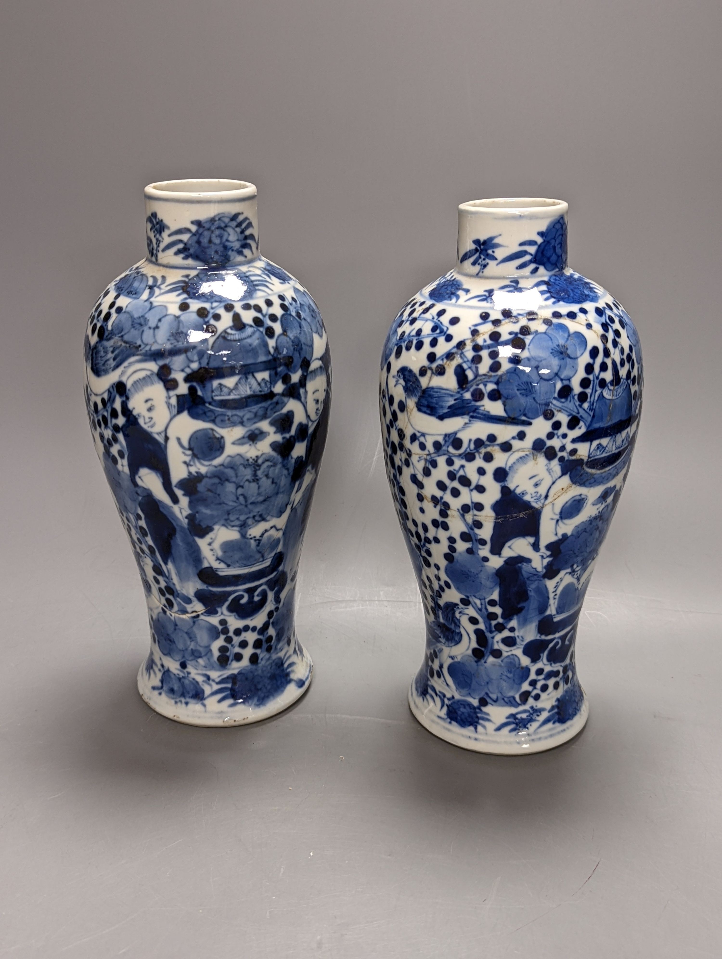 A pair of 19th century Chinese blue and white vases, a prunus vase and cover and a similar jar (4), pair of vases 24 cms high.